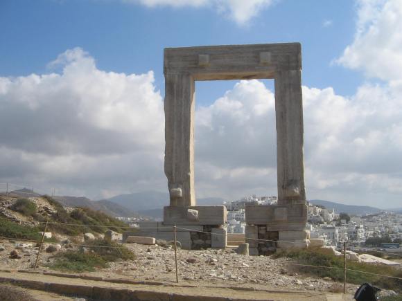 ICONIC RUINS OF THE TEMPLE OF APOLLO WHICH STANDS OVERLOOKING THE HARBOUR ON THE ISLAND OF NAXOS.